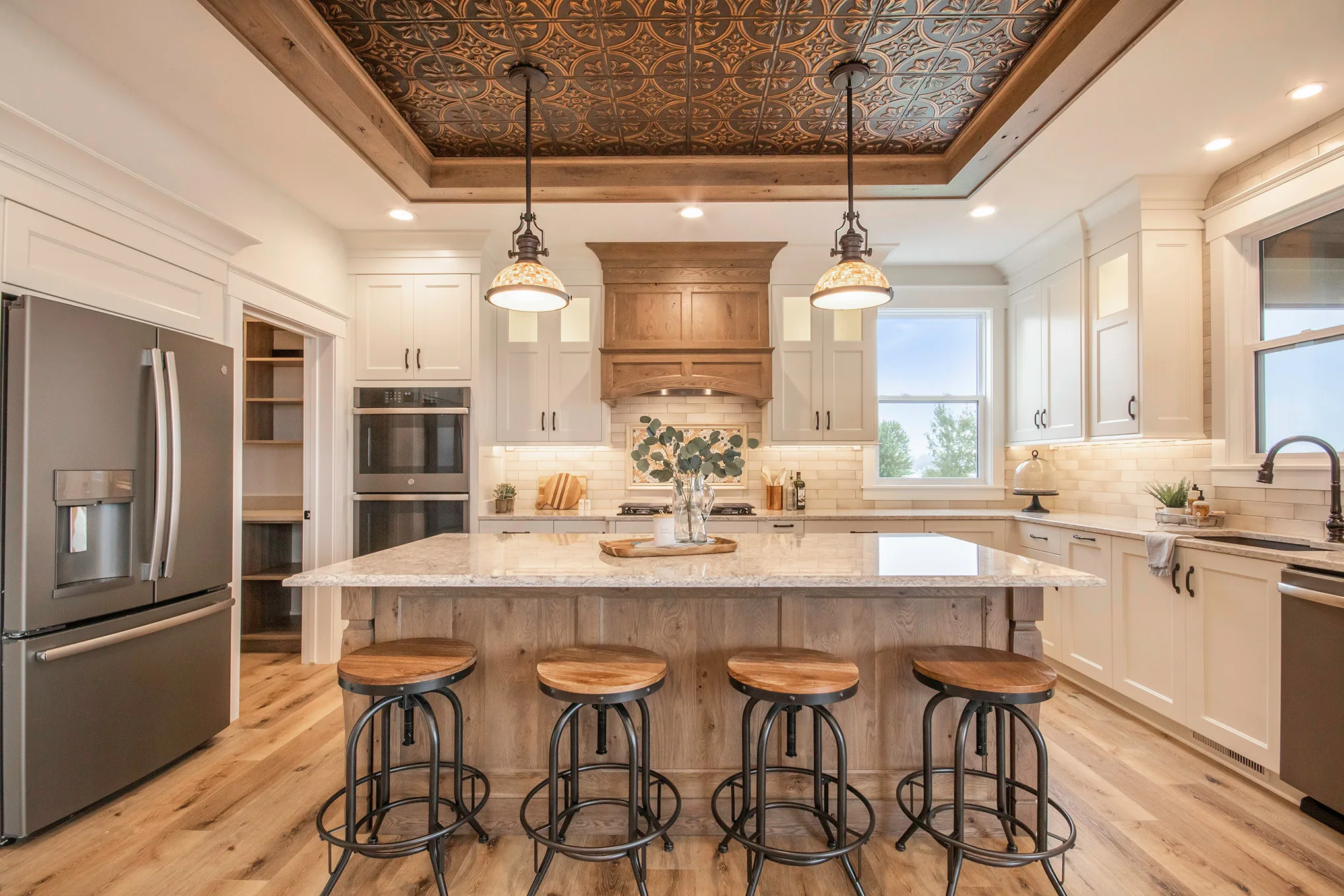 Kitchen with vinyl plank flooring and island seating